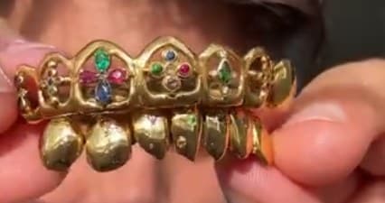 Gold open-face top grill set with green, red and blue stones